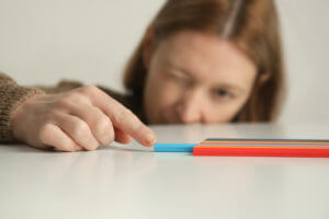 An adult woman is struggling with a problem with perfectionism due to Obsessive-Compulsive Disorder (OCD).