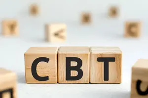 Image of wooden blocks with letters arranged to spell the acronym CBT, illustrating Cognitive Behavioral Therapy.