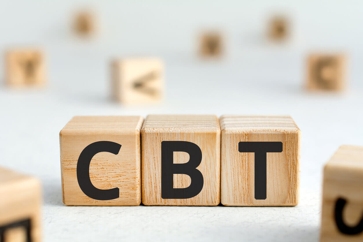Image of wooden blocks with letters arranged to spell the acronym CBT, illustrating Cognitive Behavioral Therapy.