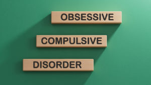 Obsessive Compulsive Disorder words on wooden blocks.